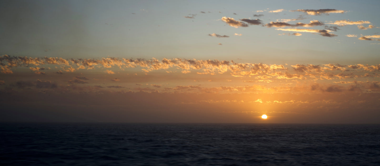 A sunset over the ocean fine art print